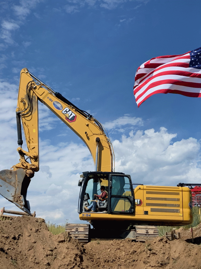HEI Team member utilizing Caterpillar Excavator