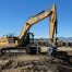 Excavator with compaction wheel attachment