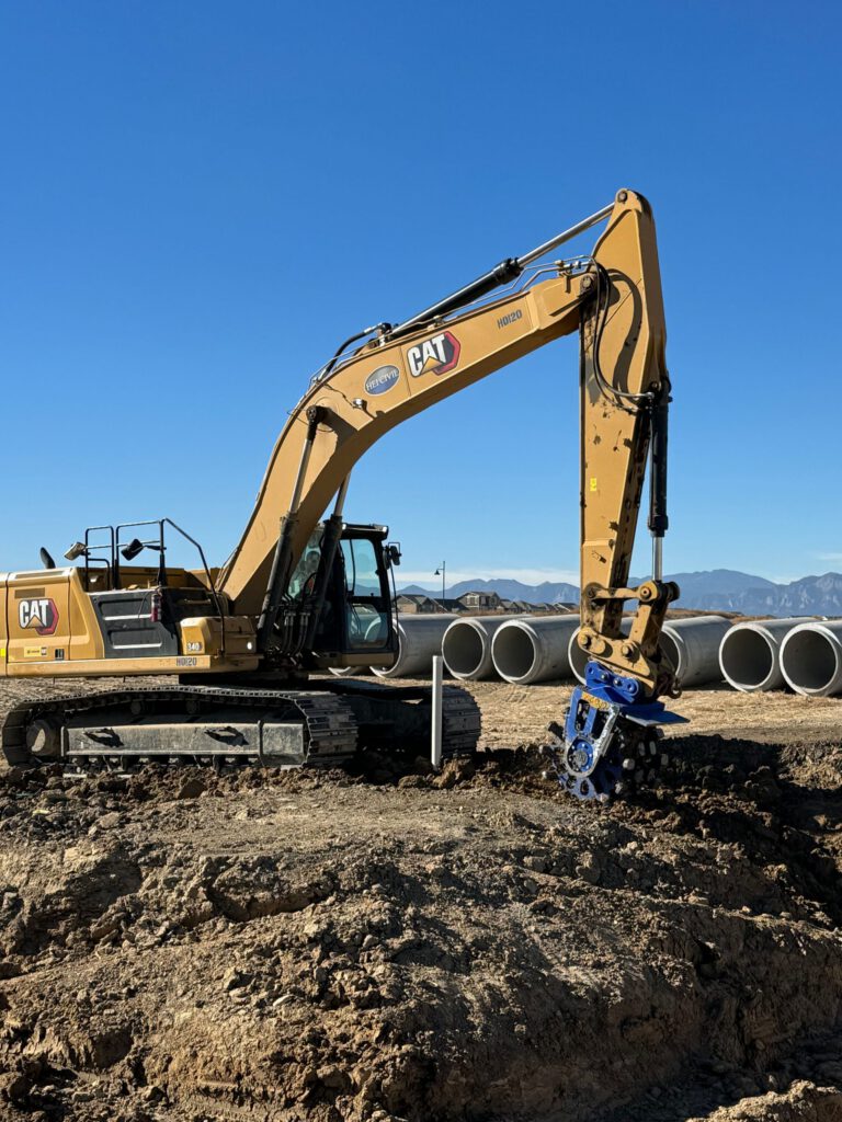 Excavator with compaction wheel attachment