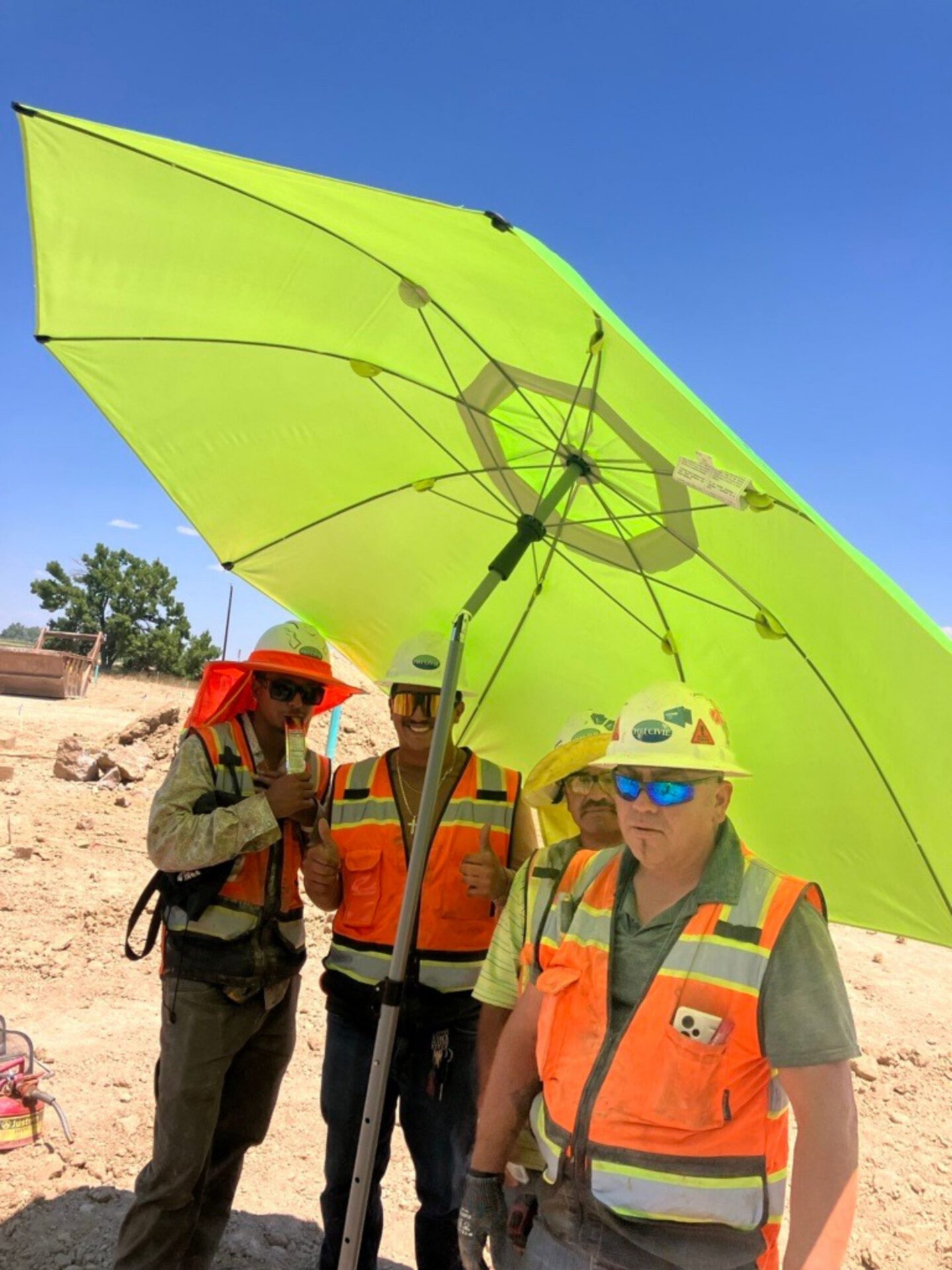 HEI Team Members Utilizing Heat Safety Measures