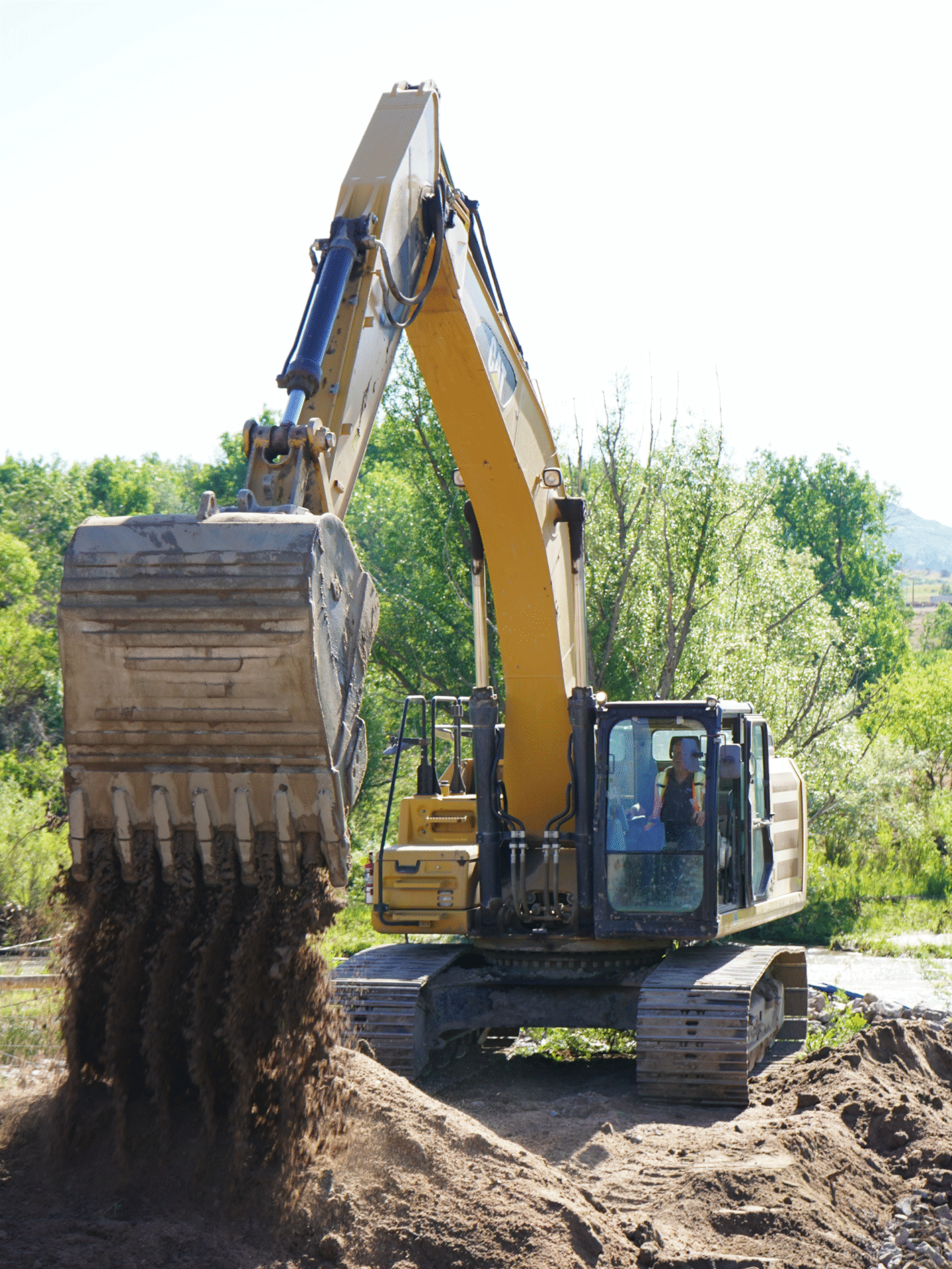 A HEI Civil team member operating an excavator